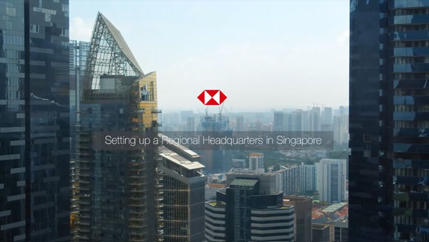 a city skyline with the HSBC logo a city skyline with the HSBC logo