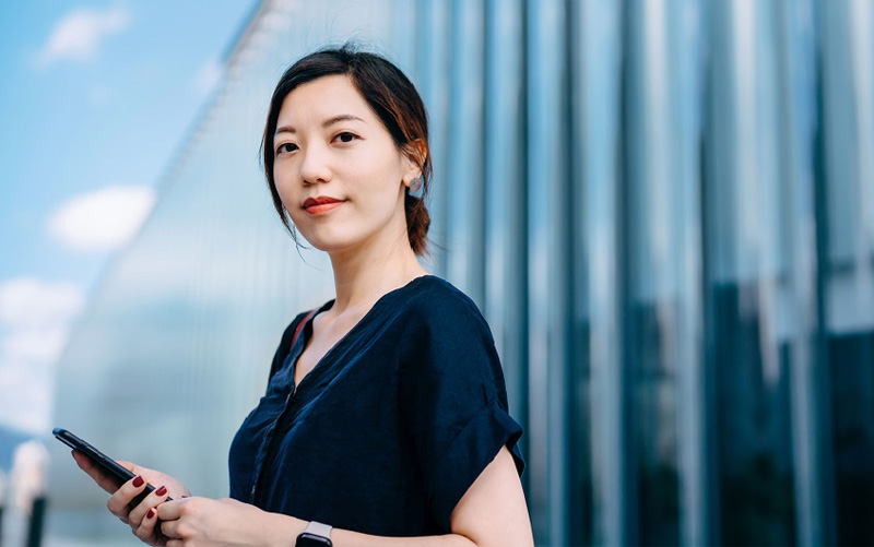 Business woman holding a phone Business woman holding a phone